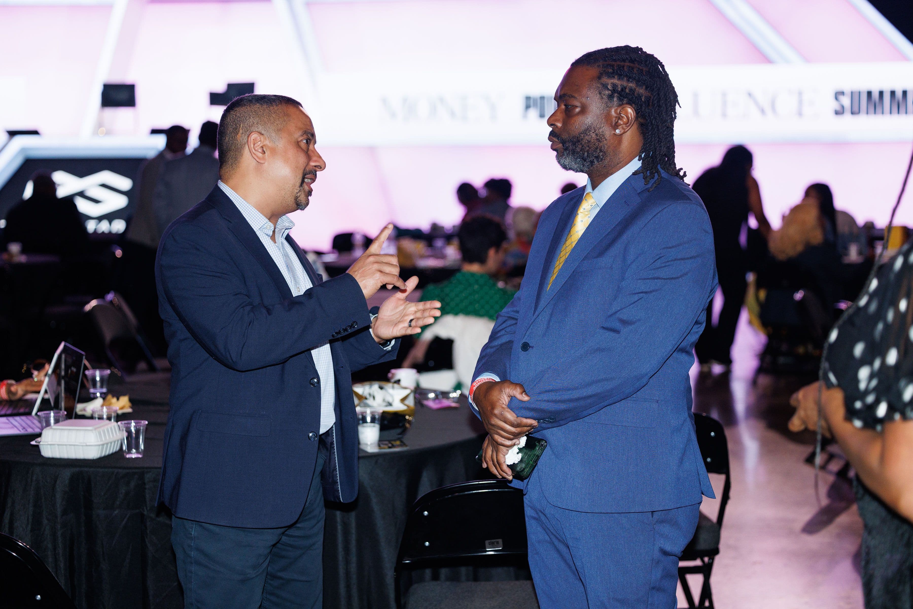 Attendees in conversation at the summit